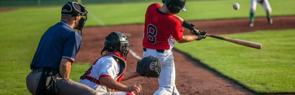 Baseball batter hits the ball