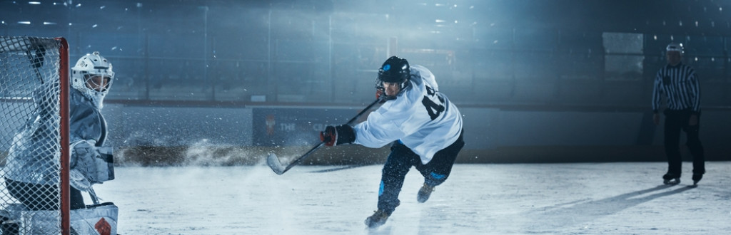 Ice Hockey Ready to Defend Score against Forward Player