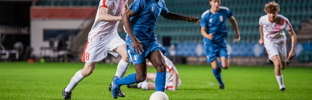 Soccer Football Match Event on a Major League Championship: Blue Team Attacks, Playing Pass, Dribbling. 