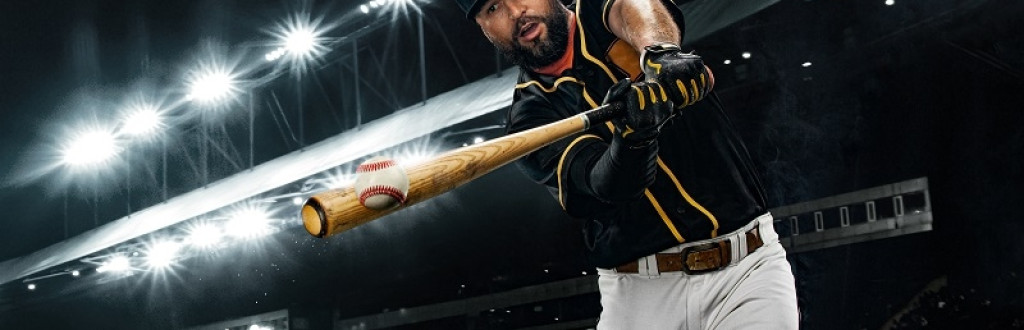 Porfessional baseball player with bat taking a swing on grand arena. Ballplayer on stadium in action.