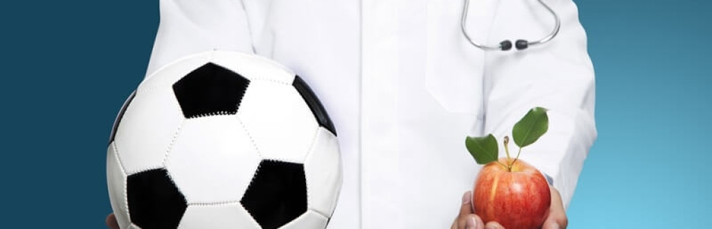 Doctor with white soccer ball and apple