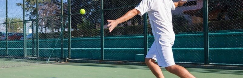 tennis player playing a game of tennis on a court