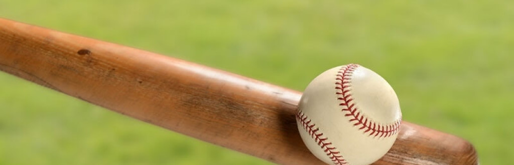 hitting ball with wooden baseball bat