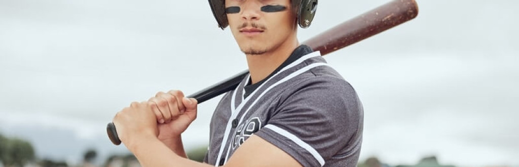 male baseball player with bat