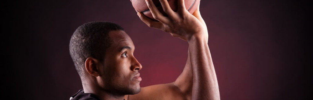 male basketball player about to shoot the ball