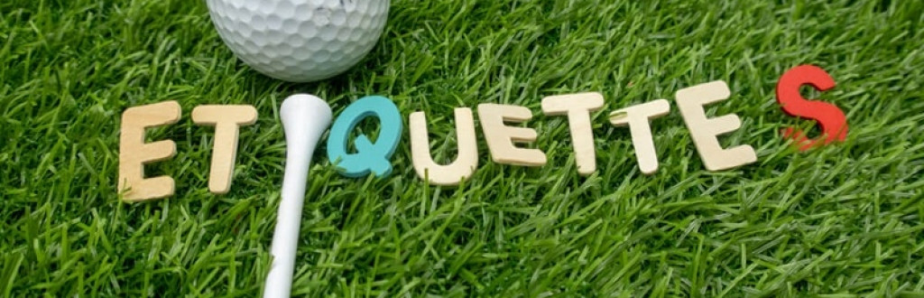 Etiquette word with golf ball and tee is on green grass